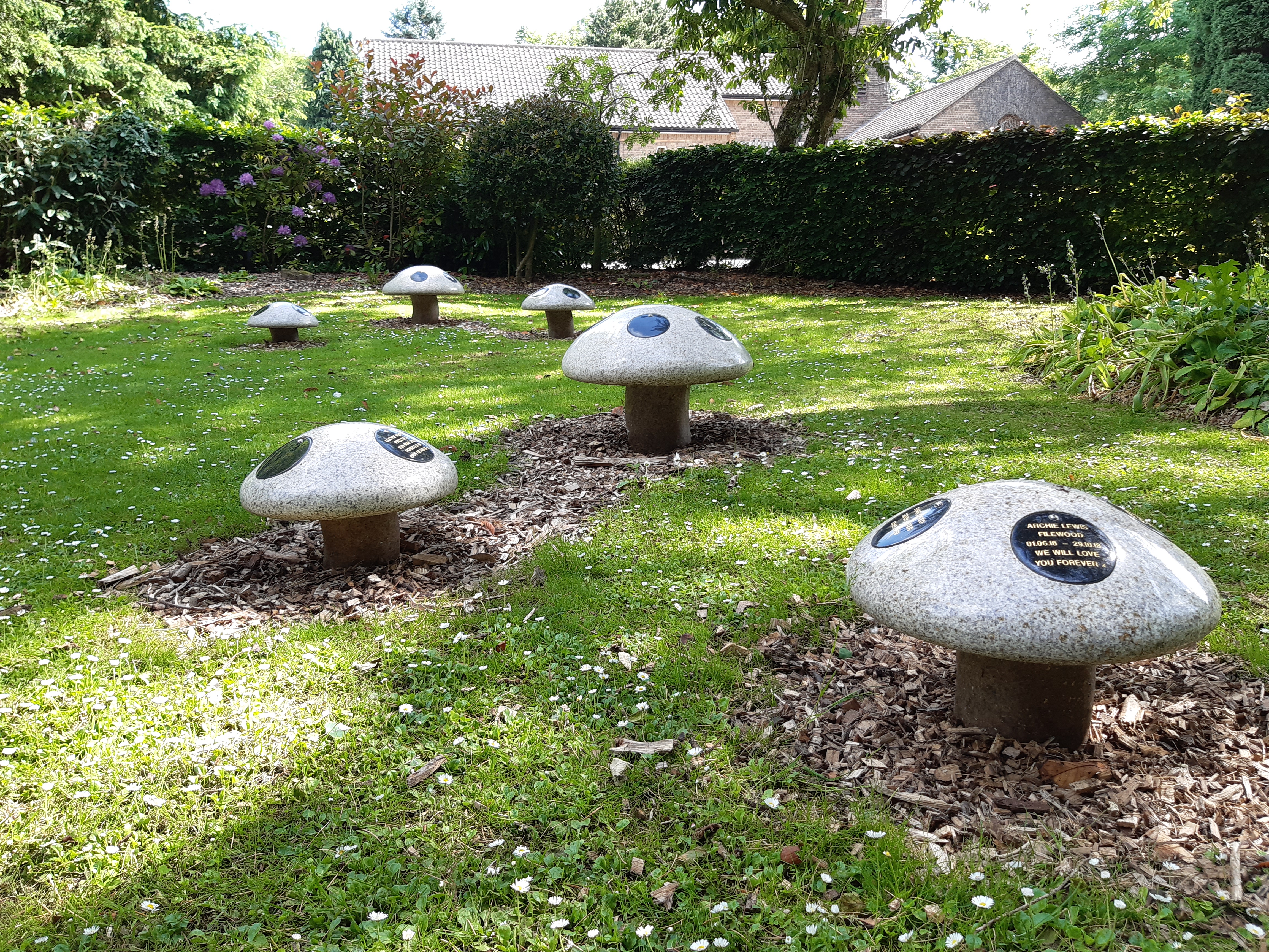 an image showing a dear mum carved mushroom memorial