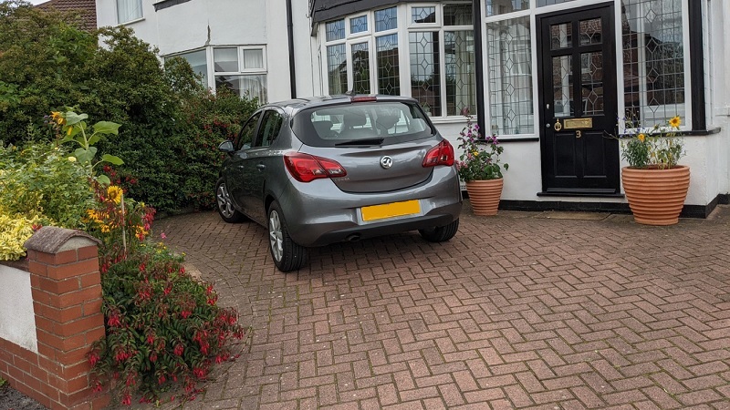 Example of paved front garden driveway and plants