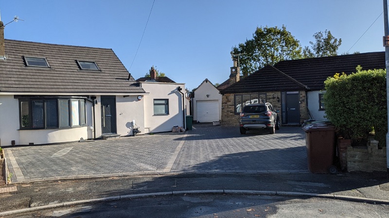 Example of bungalows with paved driveway and minimal green space